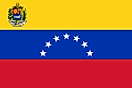 Yellow, blue, and red horizontal flag with official seal in canton and seven white stars forming a half a circle on blue