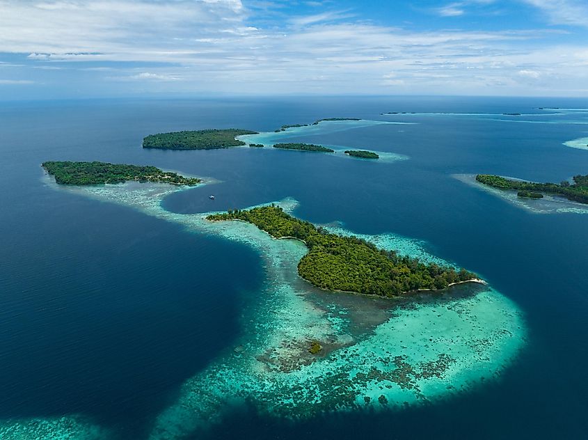 Lush, tropical islands are fringed by robust coral reefs in the Solomon Islands. 