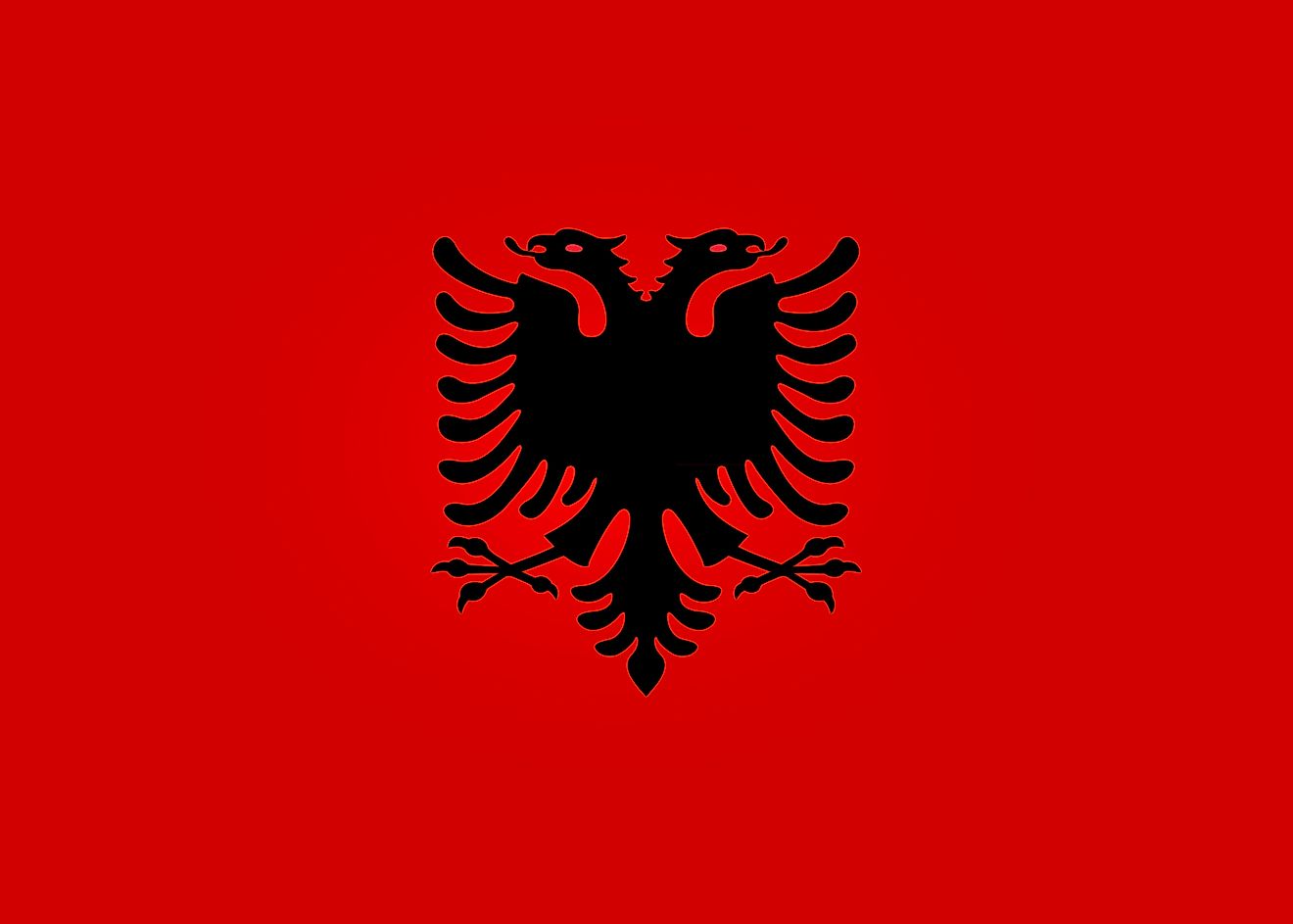 The National Flag of Albania - Flamuri Kombëtar  features a red background with a double-headed eagle placed in the center.