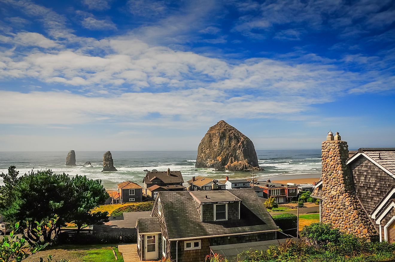 View of the beach and Haystack Rock along the coast of Cannon Beach, Oregon.