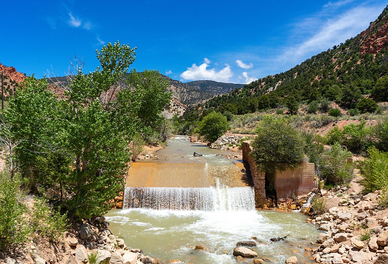 A river that leads into a waterfall on a hiking trail in Cedar City, Utah.