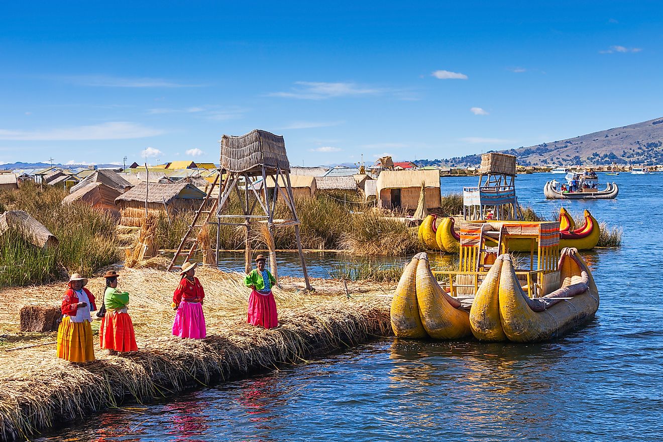 Locals welcome tourists to Uros Island on Lake Titicaca.