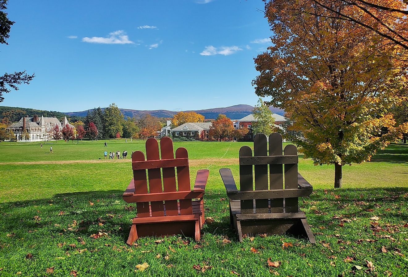 Adirondack chairs overlooking scene of Vermont foliage at Middlebury College.