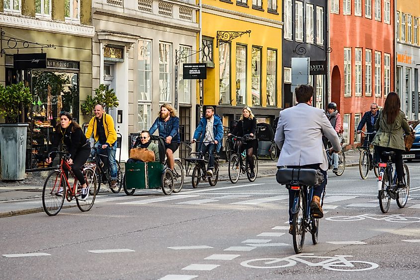 People riding bicycles in old city center. COPENHAGEN; DENMARK