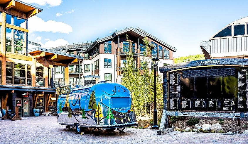 Snowmass village town square in base town in Colorado downtown with nobody and airstream truck by sign