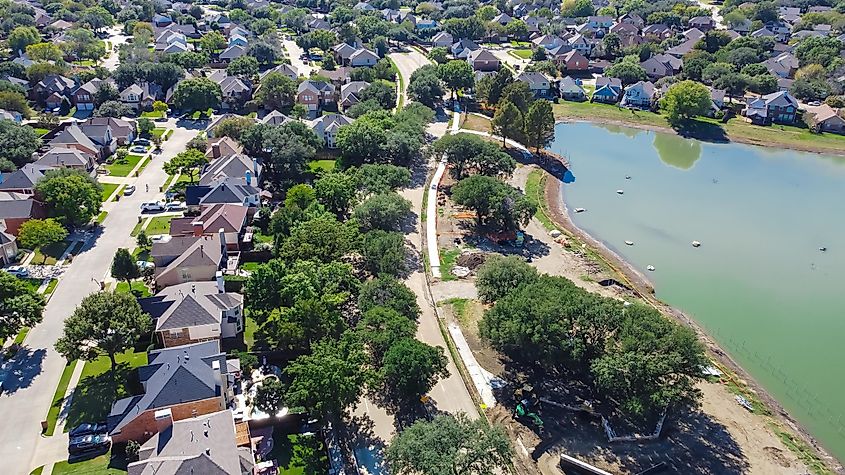 An aerial view of the tree-line, lakeside community of Flower Mound, Texas