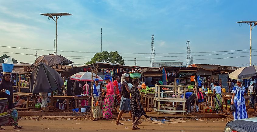 Vendors selling their goods in a street market-CONAKRY, GUINEA. Image used under license from Shutterstock.com.