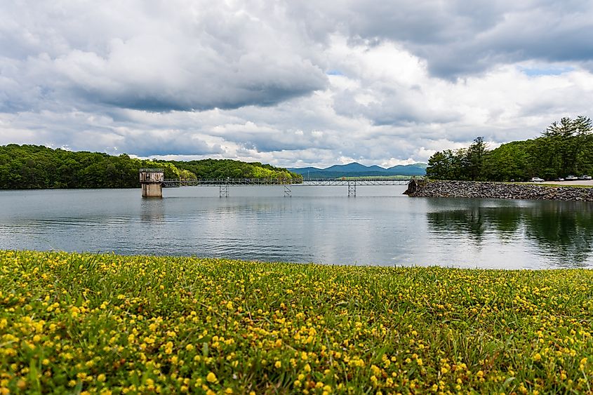 Blue Ridge Lake in Georgia, USA, presents a dramatic scene with clouds, mountains, and the lake.