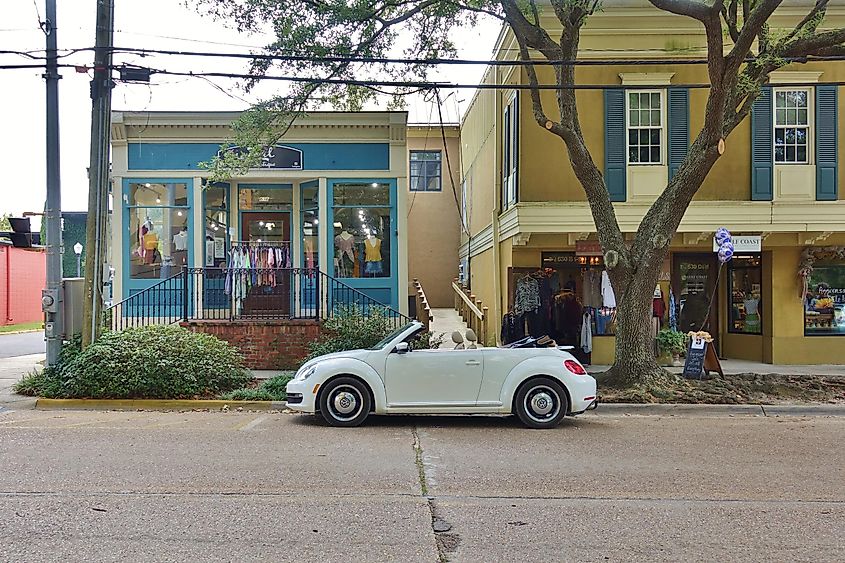 Car parked outside of stores in downtown Ocean Springs, Mississippi.