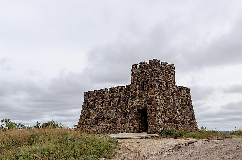The castle in Coronado Heights Park, situated high on a hill under a cloudy sky, outside of Lindsborg, Kansas.