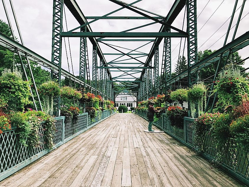 Simsbury, Connecticut: The Old Drake Hill Flower Bridge, originally carrying Drake Hill Road over the Farmington River, is one of three surviving Parker truss bridges in the United States.
