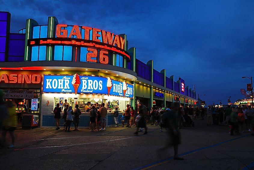 A movie theater marquee is illuminated on the boardwalk on a summer night in Wildwood, New Jersey. Editorial credit: James Kirkikis / Shutterstock.com
